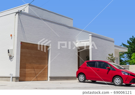 Newly built house _ Design house, red car and blue sky 69006121