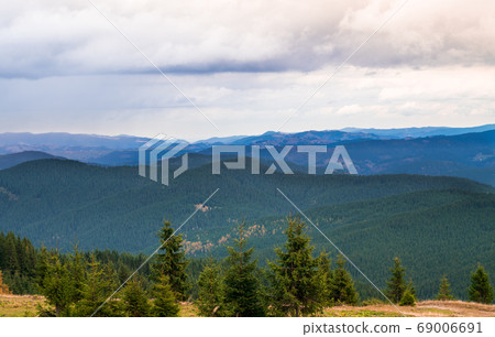 Summer landscape in mountains and the dark cloudy Summer landscape in mountains and the dark cloudy 69006691