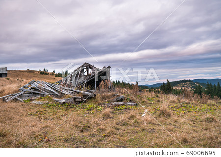 A pile of gray wooden planks of old ruined tourist A pile of gray wooden planks of old ruined tourist 69006695