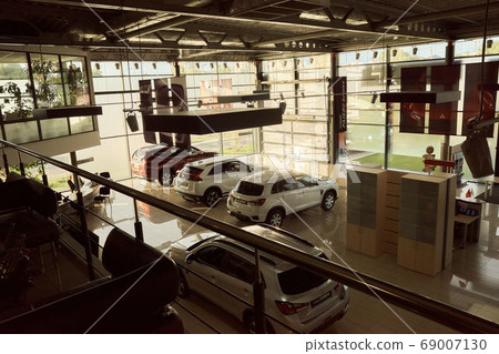 Kiev Ukraine - august 13.2020 Sale of new cars, interior of a car showroom. Buy a new car Kiev Ukraine - august 13.2020 Sale of new cars, interior of a car showroom. Buy a new car 69007130
