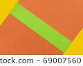 Green, Orange and Yellow coloured paper background 69007560