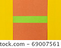 Green, Orange and Yellow coloured paper background 69007561