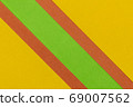 Green, Orange and Yellow coloured paper background 69007562