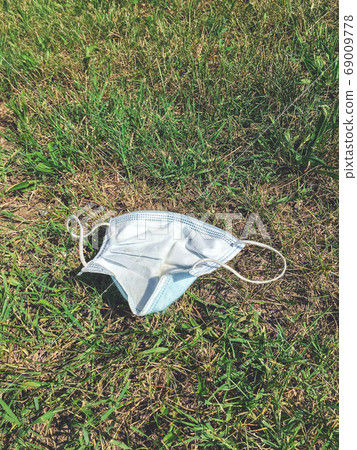 Medical protective mask thrown to the ground Medical protective mask thrown to the ground 69009778