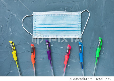 Medical mask and pens, back to school concept 69010559