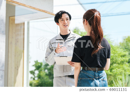 Image of a building contractor explaining construction work Image of a building contractor explaining construction work 69011131