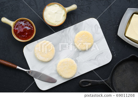 Top view of fresh cheese pancake on marble serving 69011208