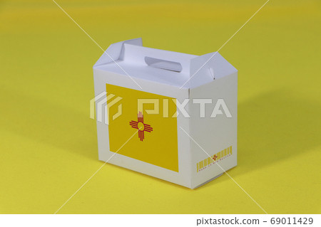 New Mexico flag on white box with barcode and the color of states flag on yellow background. 69011429
