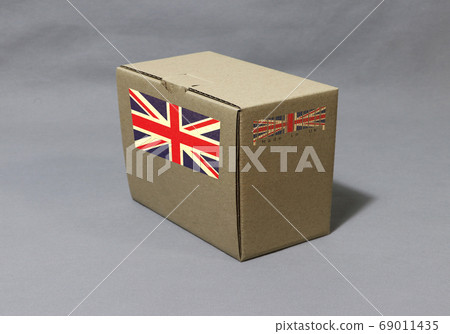 Union Jack flag on brown box with barcode, paper packaging for put products. Union Jack flag on brown box with barcode, paper packaging for put products. 69011435
