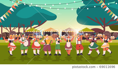mix race people in face masks drinking beer and having fun Oktoberfest festival celebration concept mix race people in face masks drinking beer and having fun Oktoberfest festival celebration concept 69011696