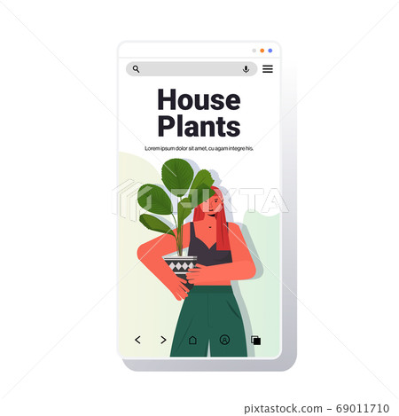 woman taking care of houseplants housewife holding potted plant smartphone screen portrait 69011710