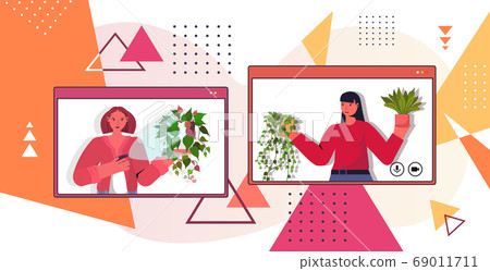 women taking care of houseplants housewives discussing during video call in web browser windows 69011711