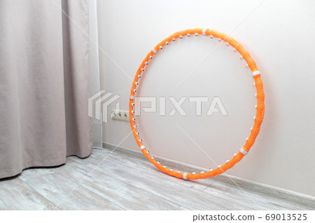 Hula hoop for gymnastics at home. weight loss concept. Sport equipment 69013525