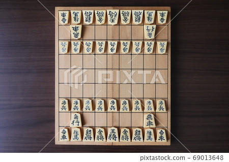 Pieces arranged in the initial position with the shogi board Pieces arranged in the initial position with the shogi board 69013648