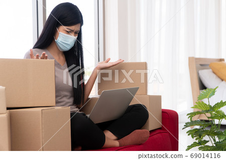 Unhappy Asian young entrepreneur on a mask, Tired 69014116