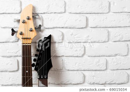 Guitar headstock with tuners on dark background Guitar headstock with tuners on dark background 69015034