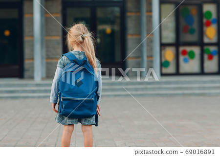Cute little girl with backpack going back to school 69016891