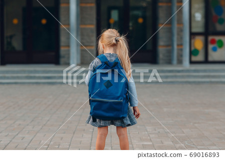 Cute little girl with backpack going back to school 69016893