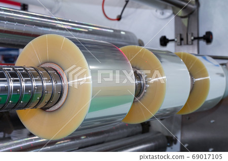 plastic packaging film on automatic packing machine in food product factory. industrial concept. . 69017105