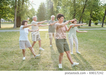 Doing qigong exercise 69017242