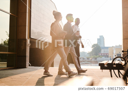 Business colleagues going to meeting Business colleagues going to meeting 69017307