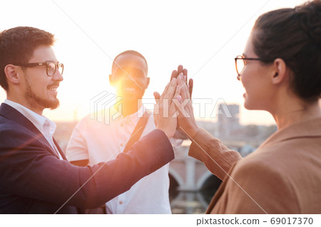 Business team supporting each other 69017370