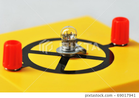 incandescent lamp on a yellow stand - equipment incandescent lamp on a yellow stand - equipment 69017941