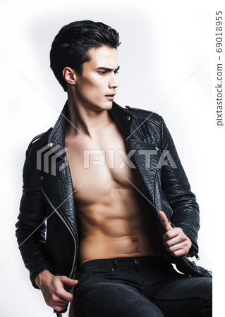 young handsome man, leather jacked on naked torso, emotional posing, white background, modern guy, lifestyle people concept young handsome man, leather jacked on naked torso, emotional posing, white background, modern guy, lifestyle people concept 69018955
