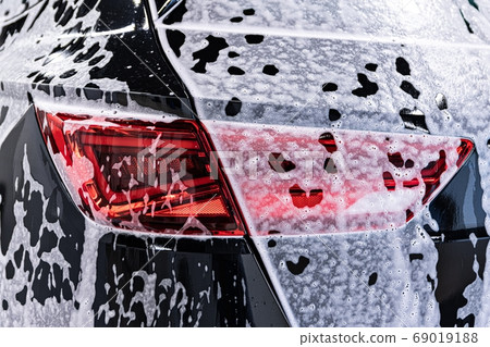 Cleaning modern car with active foam 69019188