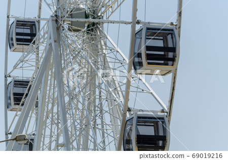 big wheel in the seaside village, in the big wheel in the seaside village, in the 69019216