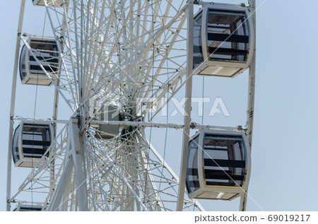 big wheel in the seaside village, in the big wheel in the seaside village, in the 69019217
