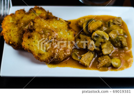 potato pancakes with spicy stew, delicious potato pancakes with spicy stew, delicious 69019381