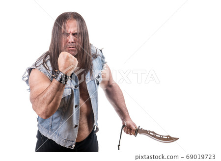 Aggressive man in jeans jacket threaten with fist 69019723