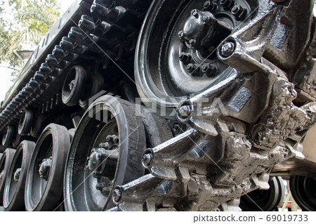 A closeup of tracks of an old tank. The part of A closeup of tracks of an old tank. The part of 69019733