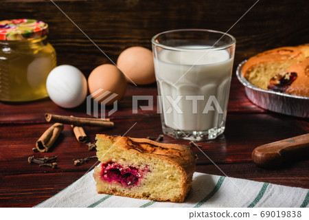 Sweet breakfast with cherry cake and glass of milk 69019838