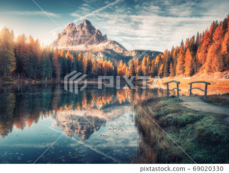 Lake with reflection in mountains at sunrise in autumn in Dolomites, Italy. Landscape with lake 69020330