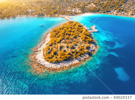 Aerial view of beutiful small island in sea bay at sunset in autumn in Murter, Croatia. Top view  69020337
