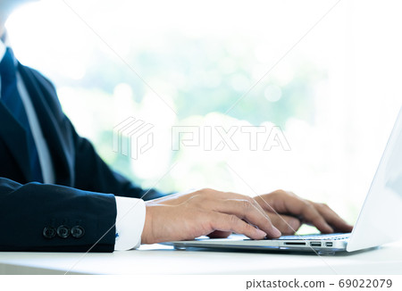 Hands of men who communicate online Hands of men who communicate online 69022079
