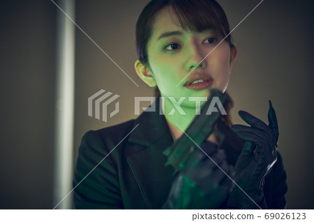 A woman with a gun A woman with a gun 69026123
