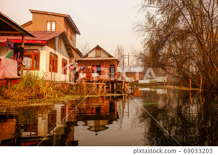 Snow mountains and Srinagar cityscape in the northernmost Kashmir region of India 69033203