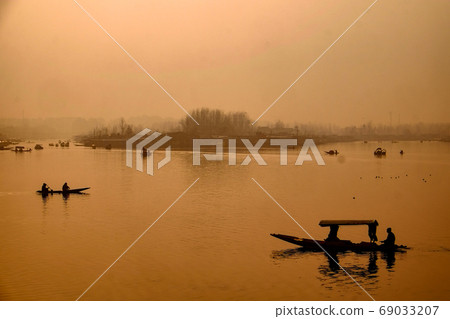 Snow mountains and Srinagar cityscape in the northernmost Kashmir region of India 69033207
