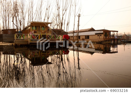 Snow mountains and Srinagar cityscape in the northernmost Kashmir region of India 69033216