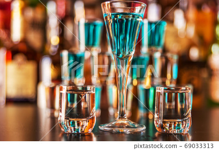 Traditional pure vodka in glasses on a black 69033313