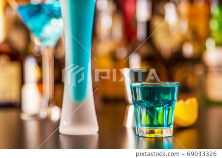 refreshing liqueur in a tall glass, alcoholic refreshing liqueur in a tall glass, alcoholic 69033326