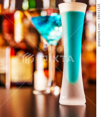 refreshing liqueur in a tall glass, alcoholic refreshing liqueur in a tall glass, alcoholic 69033328