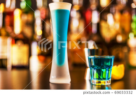 refreshing liqueur in a tall glass, alcoholic refreshing liqueur in a tall glass, alcoholic 69033332