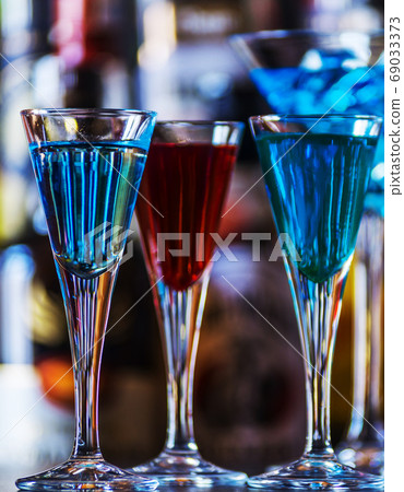 refreshing liqueur in a tall glass, alcoholic refreshing liqueur in a tall glass, alcoholic 69033373