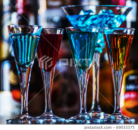 refreshing liqueur in a tall glass, alcoholic refreshing liqueur in a tall glass, alcoholic 69033375