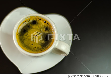 black coffee in a ceramic cup on the bar, energy black coffee in a ceramic cup on the bar, energy 69033397
