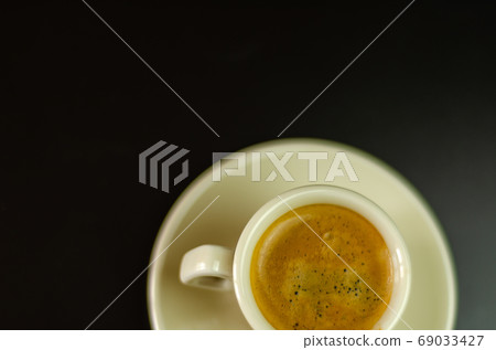 black coffee in a ceramic cup on the bar, energy black coffee in a ceramic cup on the bar, energy 69033427